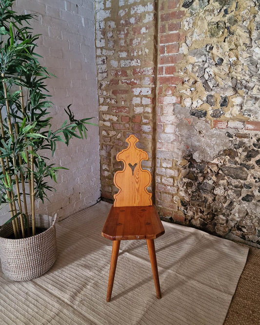 Vintage solid wood chair in Tyrolean brutalist style with carved decorative backrest, rustic farmhouse accent chair with warm wood tones