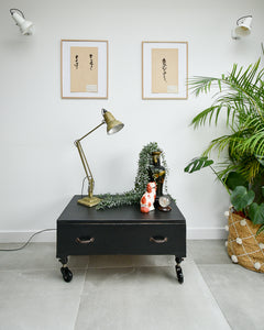 Ebonised black industrial coffee chest table on wheels with vintage handles