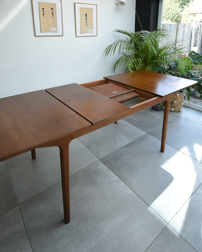 Mid Century Teak Extending Ten-Seater Dining Table and Six Chairs