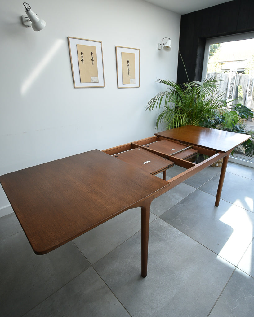Mid Century Teak Extending Ten-Seater Dining Table and Six Chairs