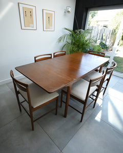 Mid Century Teak Extending Ten-Seater Dining Table and Six Chairs