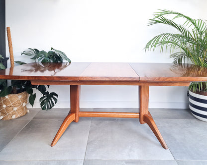 Vintage teak dining table with extension leaves, mid century Gordon Russell style table showing light age-related wear