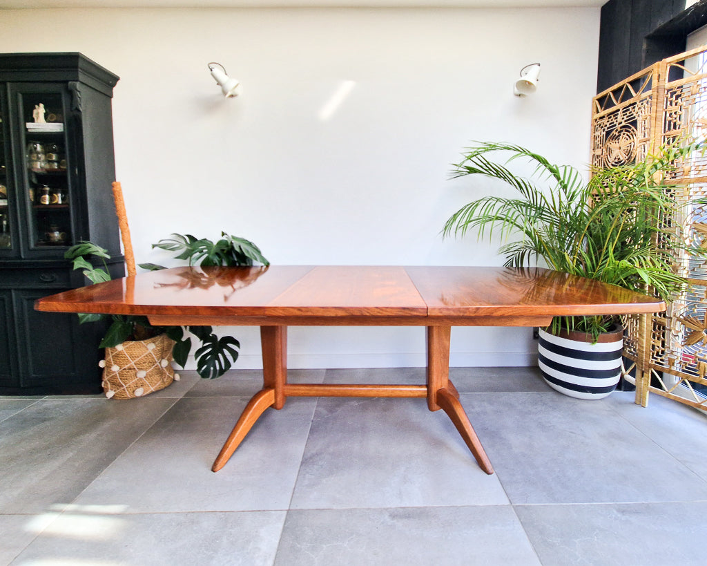 Vintage teak dining table with extension leaves, mid century Gordon Russell style table showing light age-related wear