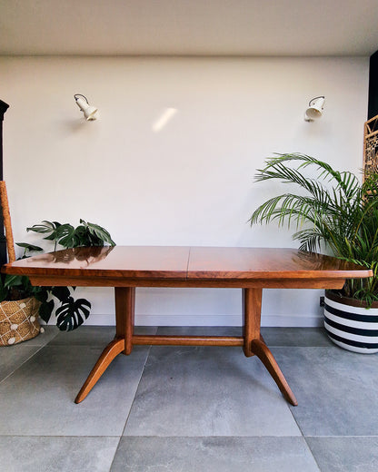 Vintage teak dining table with extension leaves, mid century Gordon Russell style table showing light age-related wear
