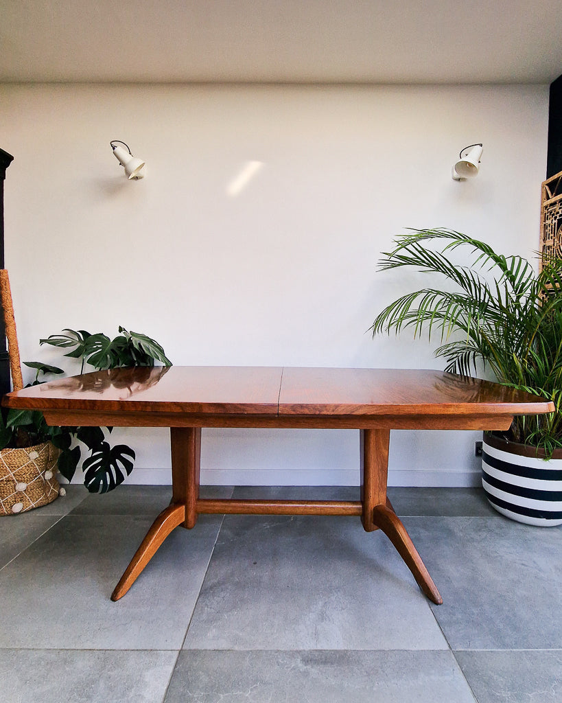 Vintage teak dining table with extension leaves, mid century Gordon Russell style table showing light age-related wear