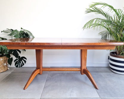 Vintage teak dining table with extension leaves, mid century Gordon Russell style table showing light age-related wear