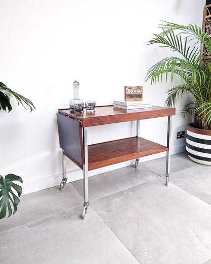 Mid century bar cart with rosewood shelves and chrome frame, vintage extendable cocktail trolley with minor surface marks