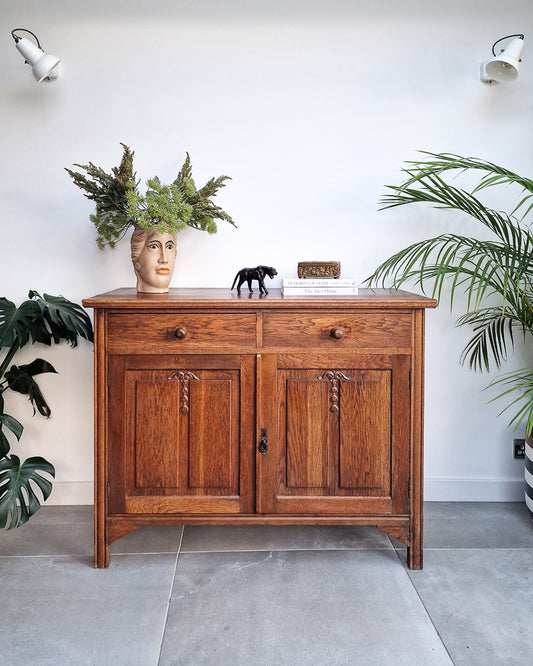 Vintage oak sideboard with carved panel doors and drawers, rustic farmhouse wooden storage cabinet for dining or living room
