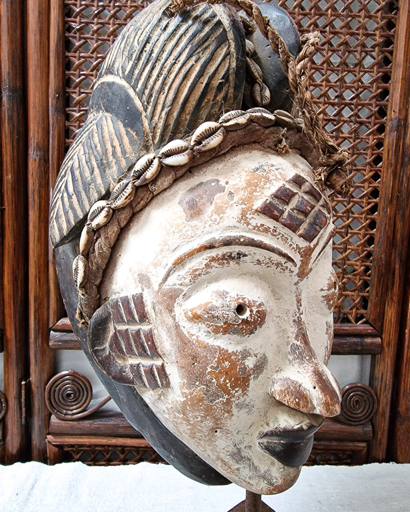 African Gabon Mask from the Punu tribe on stand