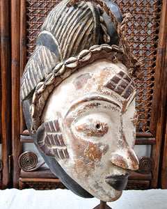 African Gabon Mask from the Punu tribe on stand